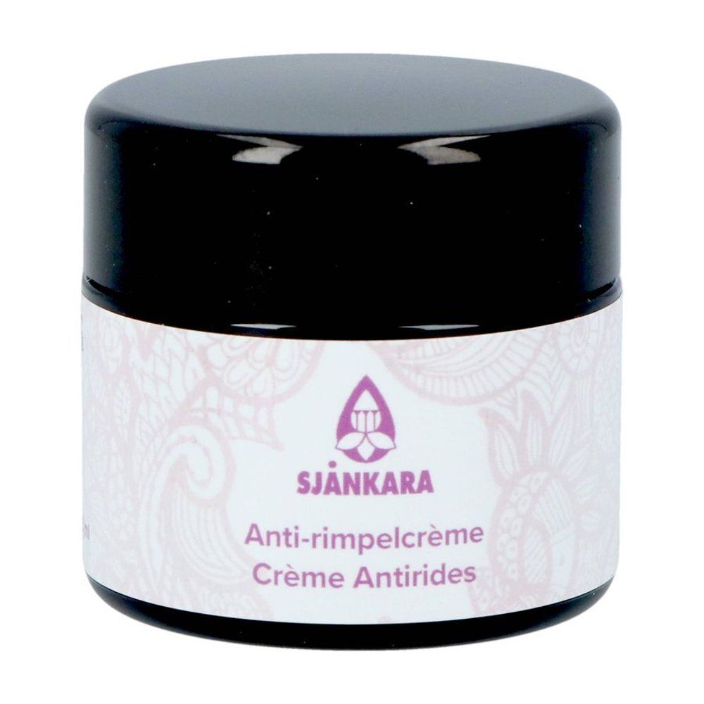 Pot de crème avec couvercle noir. Étiquette avec logo, texte : Anti-rides, Crème Antirides.