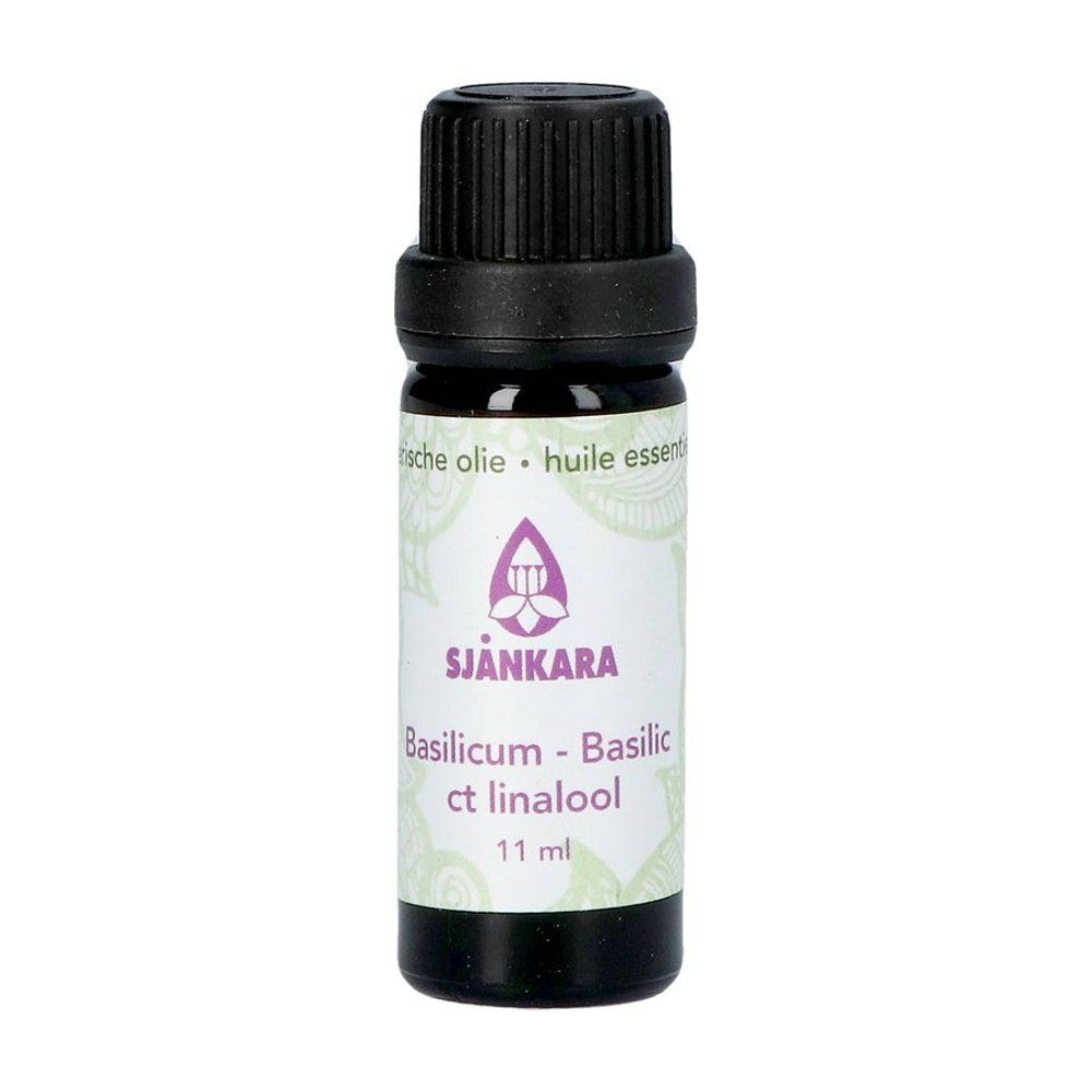 Flacon en verre brun avec bouchon noir. Étiquette avec nom du produit et logo. 11 ml.