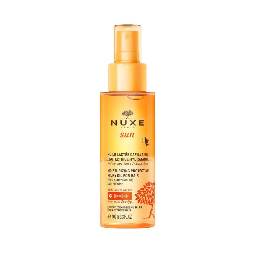 Huile Nuxe Sun pour cheveux en flacon transparent avec spray doré et étiquette.