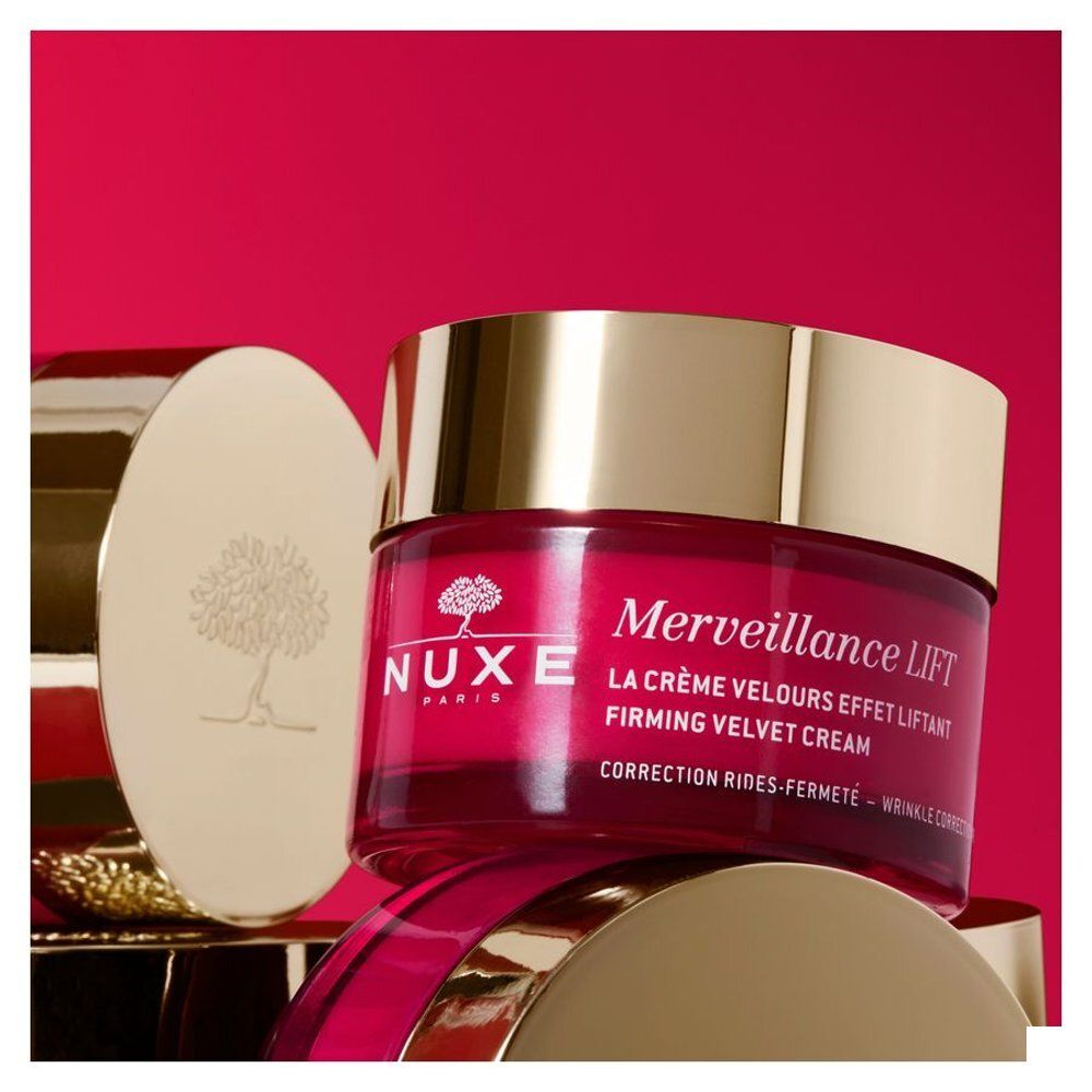 Pot Nuxe Merveillance Lift Crème Velours Effet Liftant avec couvercle argenté et corps rouge.
