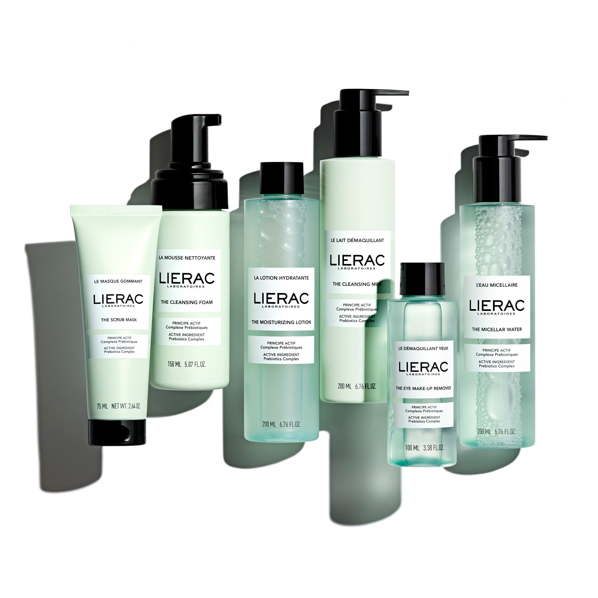 Divers produits de la marque LIERAC. Flacons, tubes et pots en vert et blanc. Inscriptions.