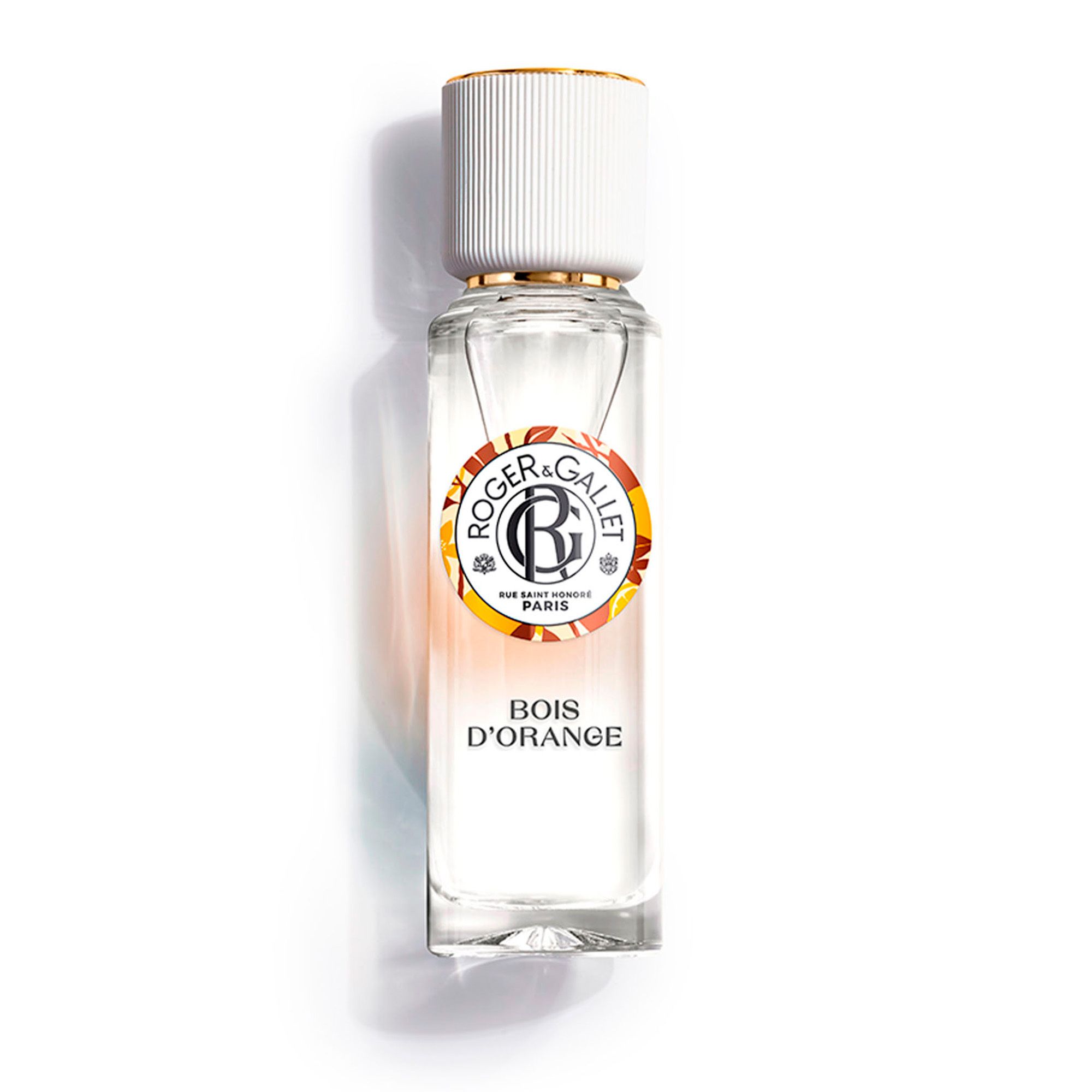 Flacon avec bouchon blanc. Étiquette: Roger & Gallet, Bois d'Orange. Contenu transparent.