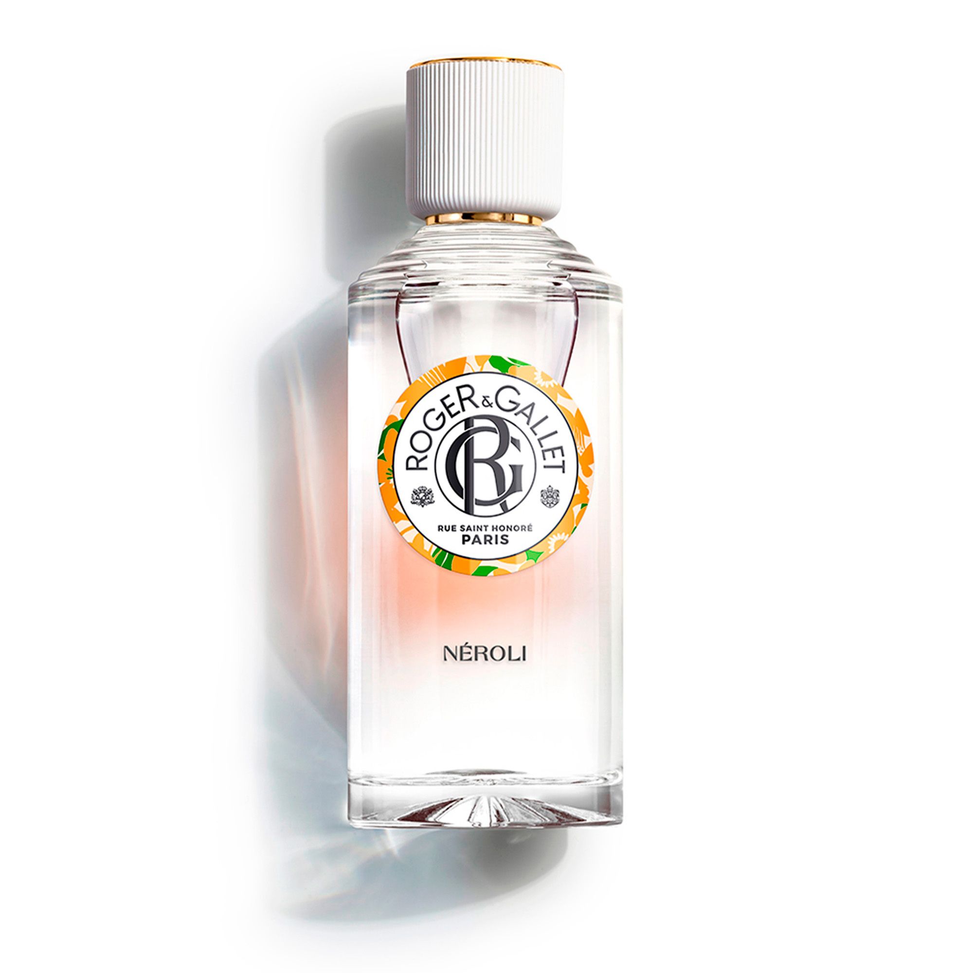 Flacon avec bouchon blanc et anneau doré. Logo Roger & Gallet. Texte: Néroli, Eau Parfumée Bienfaisante à l'essence de néroli.