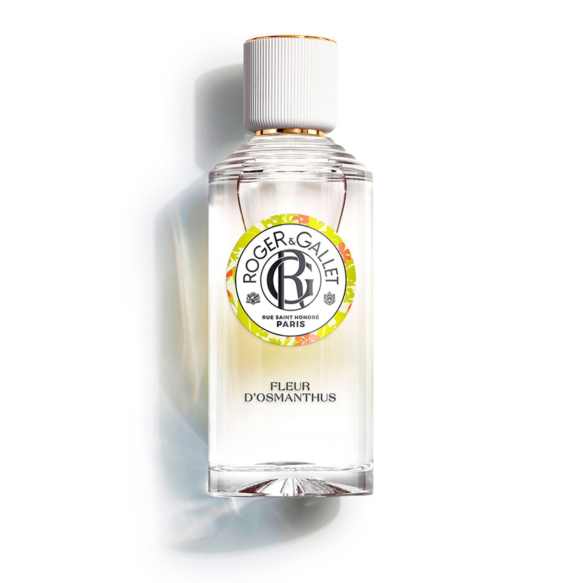 Flacon avec bouchon blanc, étiquette avec logo et nom du produit. Le flacon est sur fond blanc.