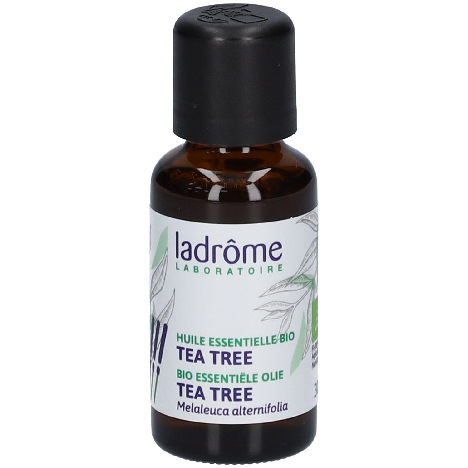 Flacon en verre brun avec bouchon noir. Étiquette "ladrôme" et "TEA TREE". Label bio.