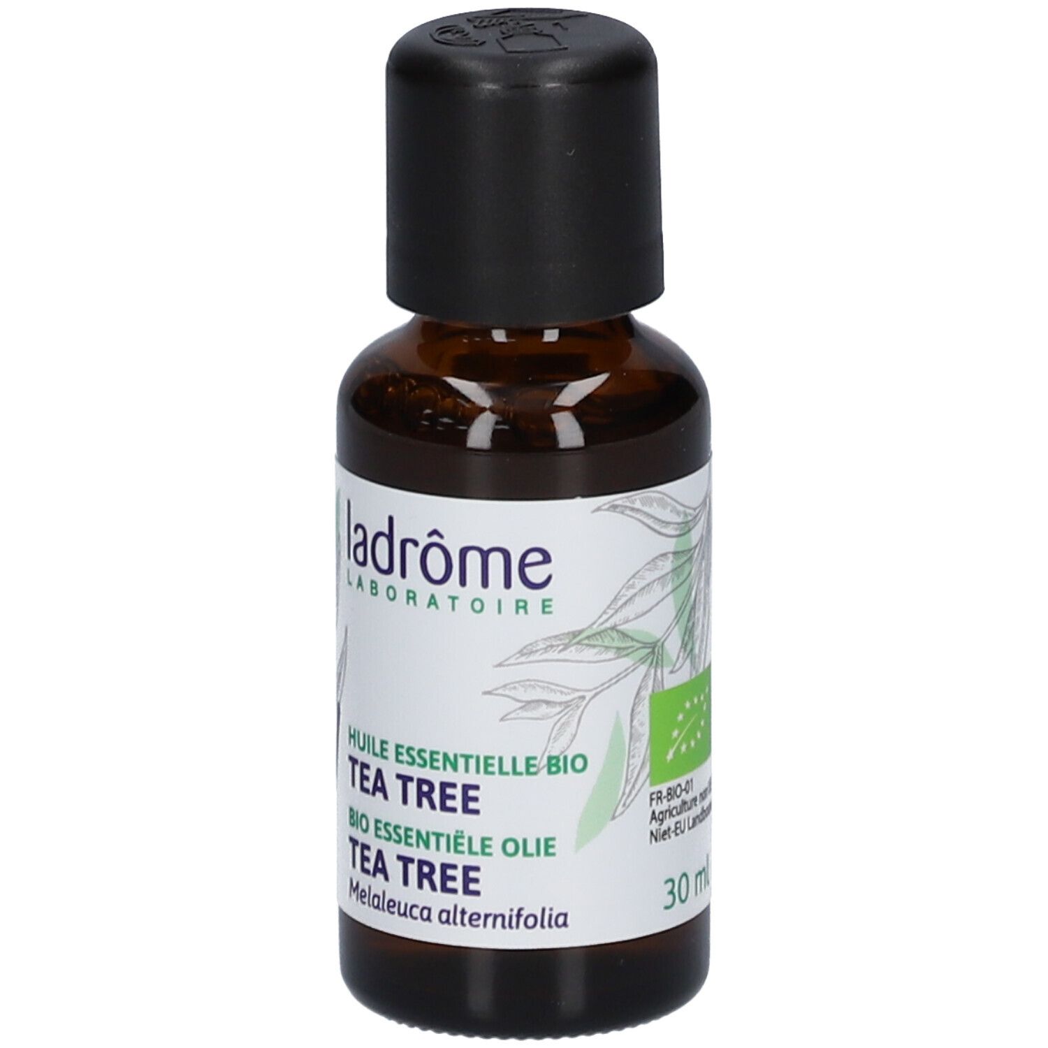 Flacon en verre brun avec bouchon noir. Étiquette "ladrôme" et "TEA TREE".