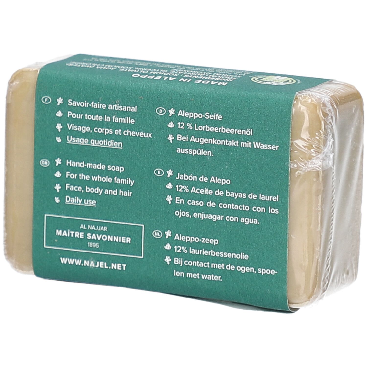 Dos d'un savon emballé, étiquette verte. Texte: Savoir-faire artisanal, visage, corps et cheveux, usage quotidien. Al Najjar, Maitre Savonnier.