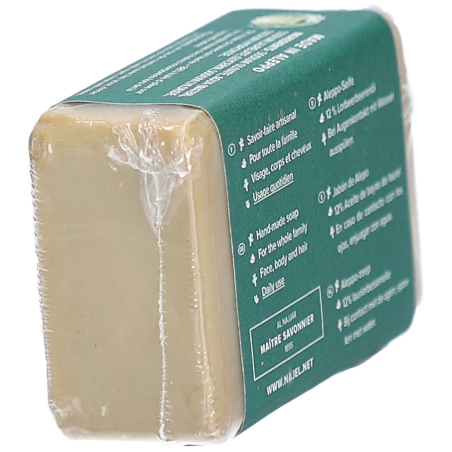 Dos d'un savon emballé, étiquette verte. Texte: Savoir-faire artisanal, visage, corps et cheveux, usage quotidien. Al Najjar, Maitre Savonnier.