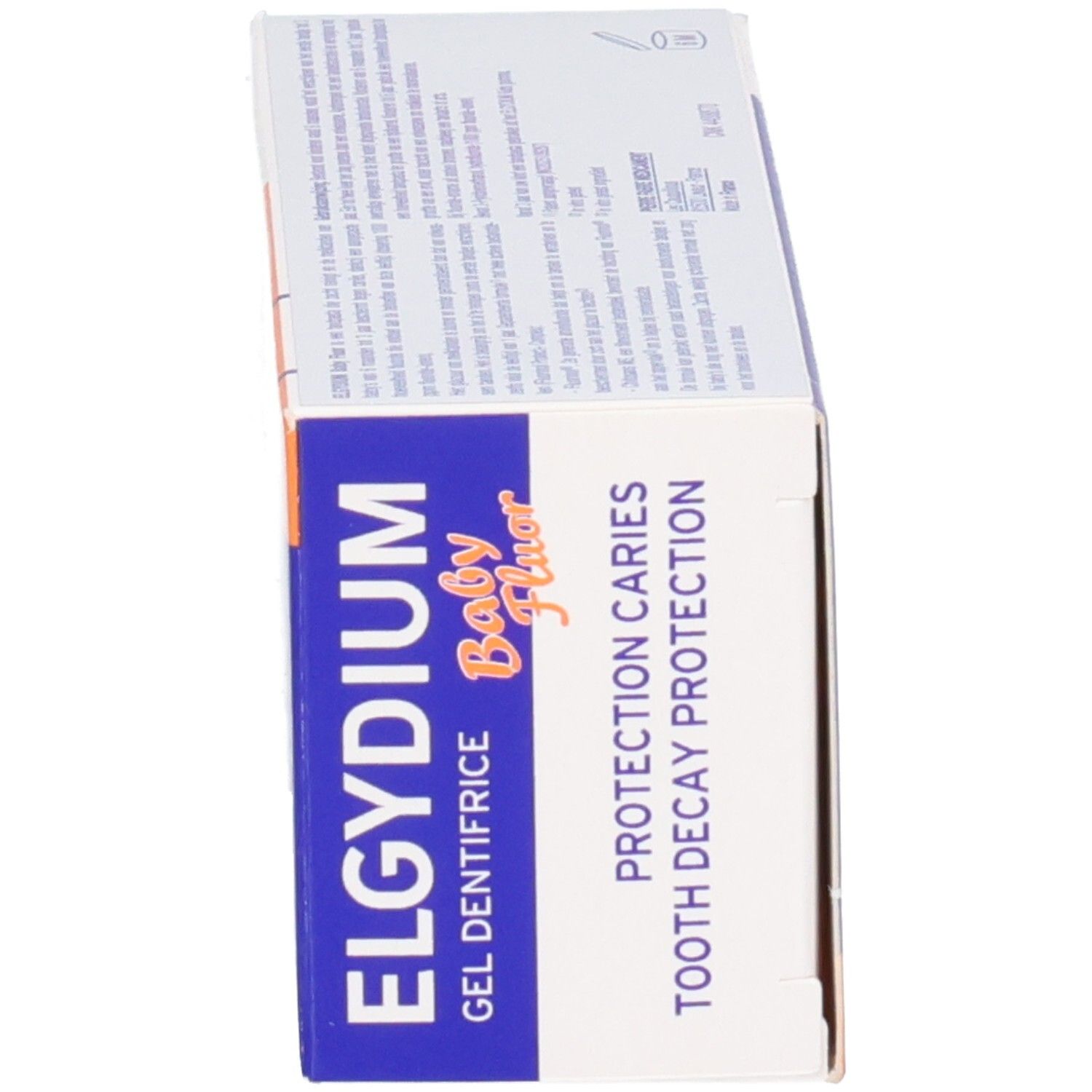 Côté de la boîte d'emballage Elgydium Baby Fluor gel dentifrice avec informations sur la protection contre les caries.