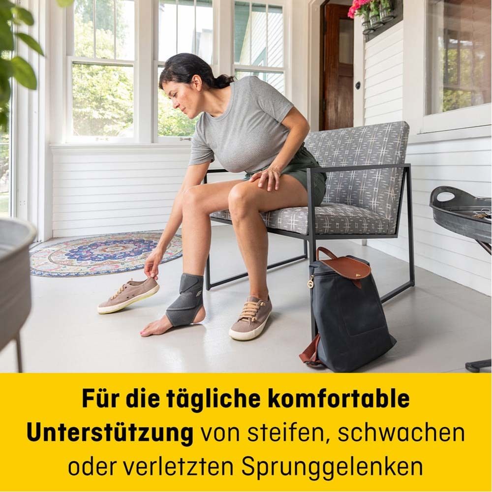 FUTURO™ Comfort Fit Knöchelbandage. Graue Bandage am Fuß. Verpackung mit Produktnamen und 3M Logo.