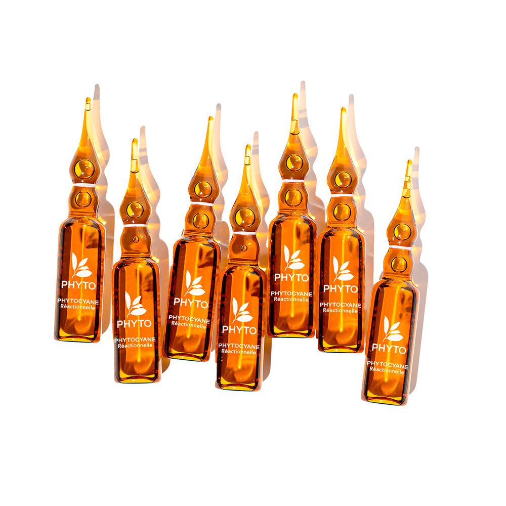 Huit ampoules ambrées. Inscription: Phyto Phytocyane. Avec bouchon jaune.