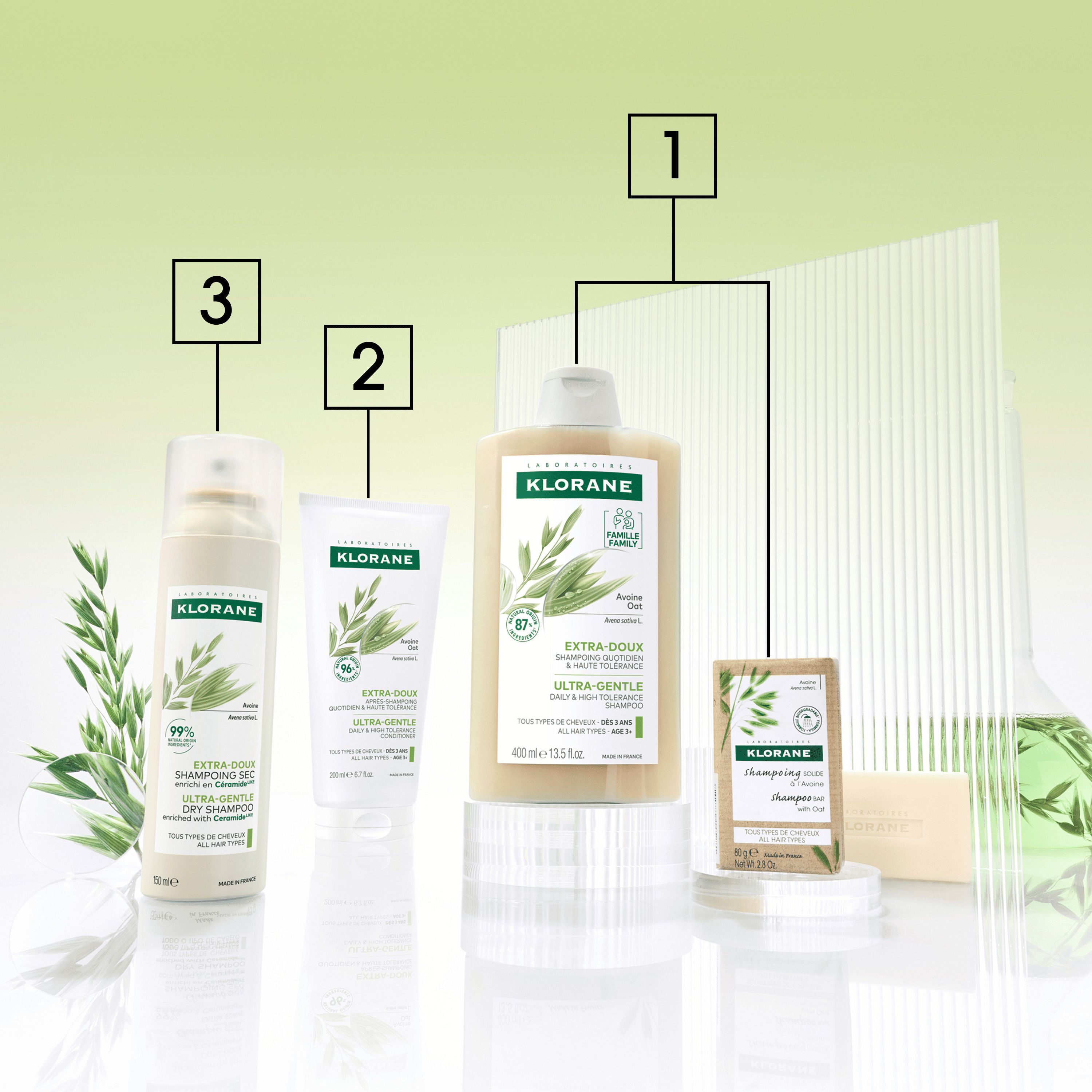 Spray de shampooing sec KLORANE. Flacon blanc avec étiquette verte. Contient de l'avoine et des céramides.