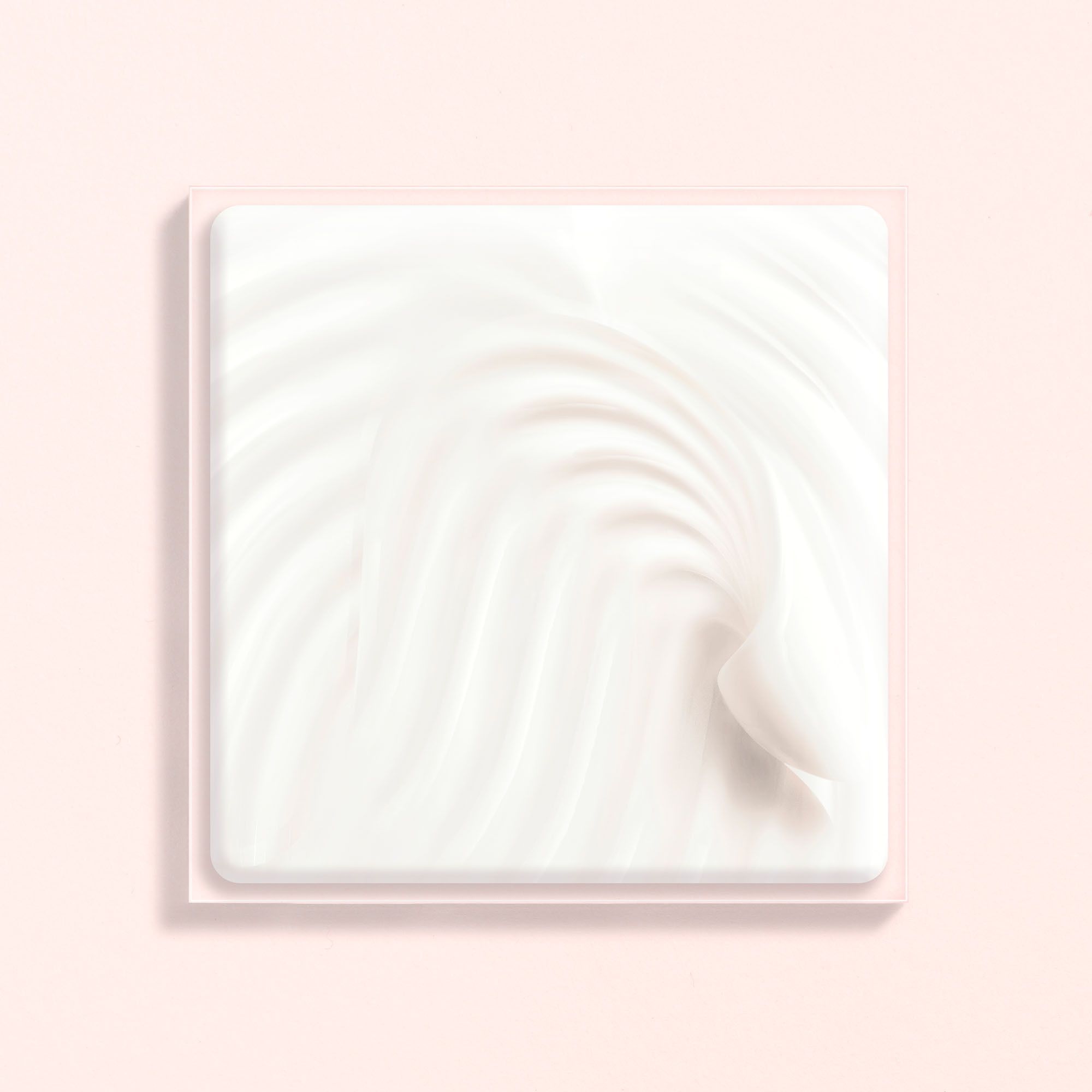 Crème sur fond rose. Forme carrée. Crème blanche.