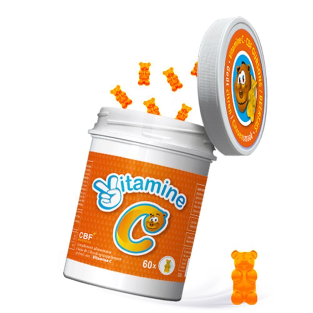 Pot de gommes à la vitamine C, ouvert. Les gommes tombent.
