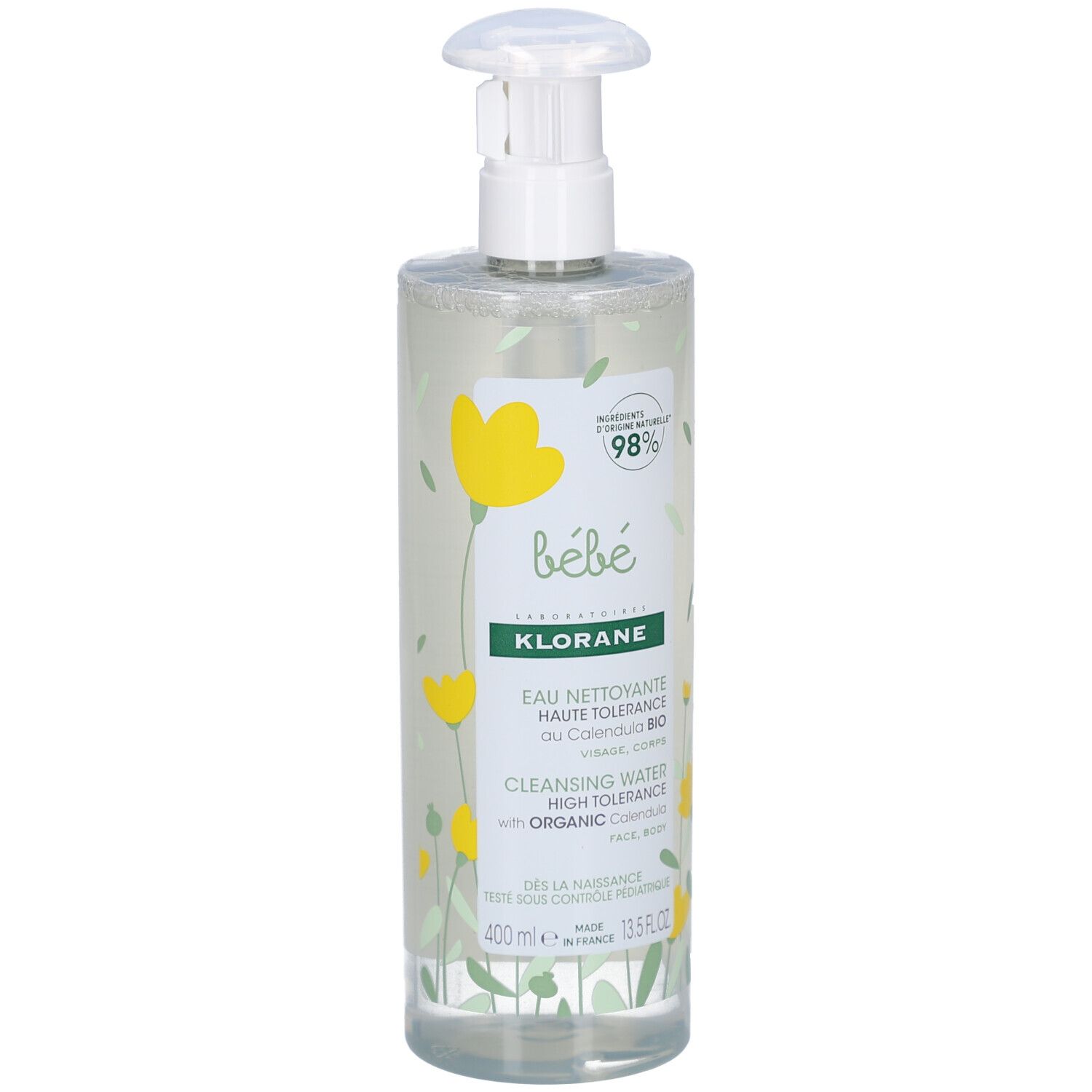 Klare Flasche mit Pumpe. Aufschrift: Klorane Bébé, Eau Nettoyante, Haute Tolérance, Visage et Corps. Gelbe Blumenmuster.
