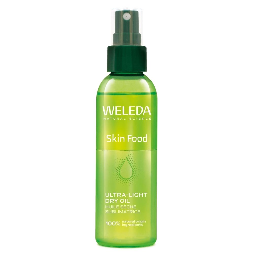 Flacon spray vert WELEDA Skin Food Ultra-Light Dry Oil, inscription française.