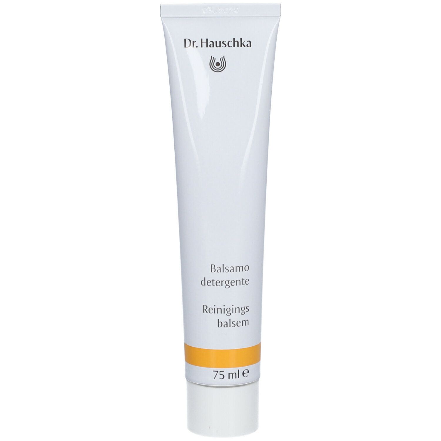 Tube blanc avec bande jaune. Inscription: Dr. Hauschka, Balsamo detergente, Reinigingsbalsem. 75 ml.