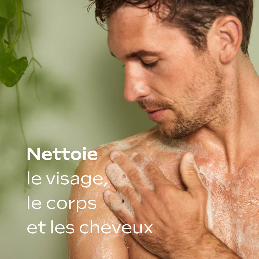 Homme se lavant l'épaule avec de la mousse. Fond vert. Texte : Nettoie le visage, le corps et les cheveux.