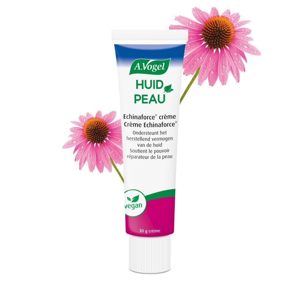 Tube de crème avec logo et nom du produit, entouré de deux fleurs roses. Label vegan.