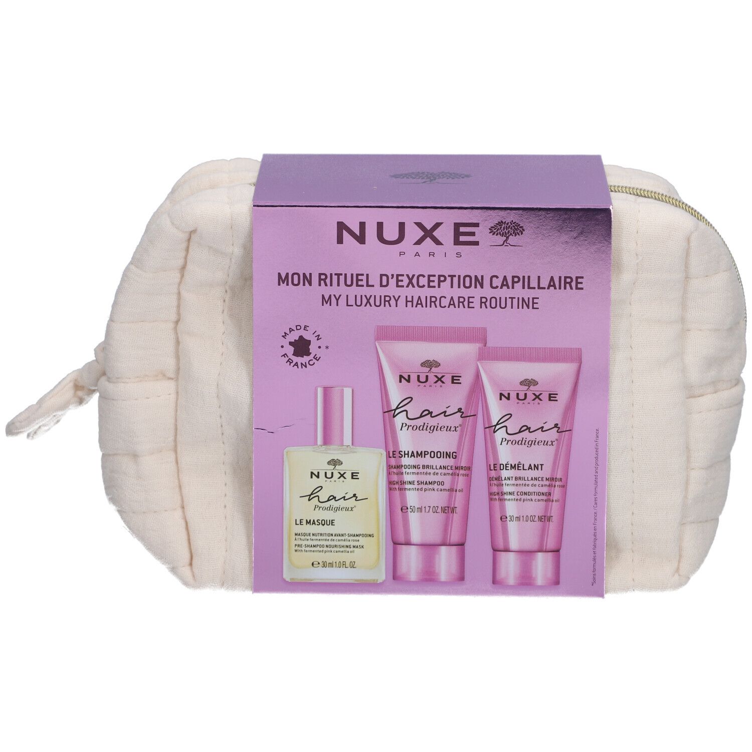 Kosmetiktasche mit NUXE-Haarpflegeprodukten. Enthält Shampoo, Spülung und Haaröl. Verpackung mit Produktnamen und Logo.