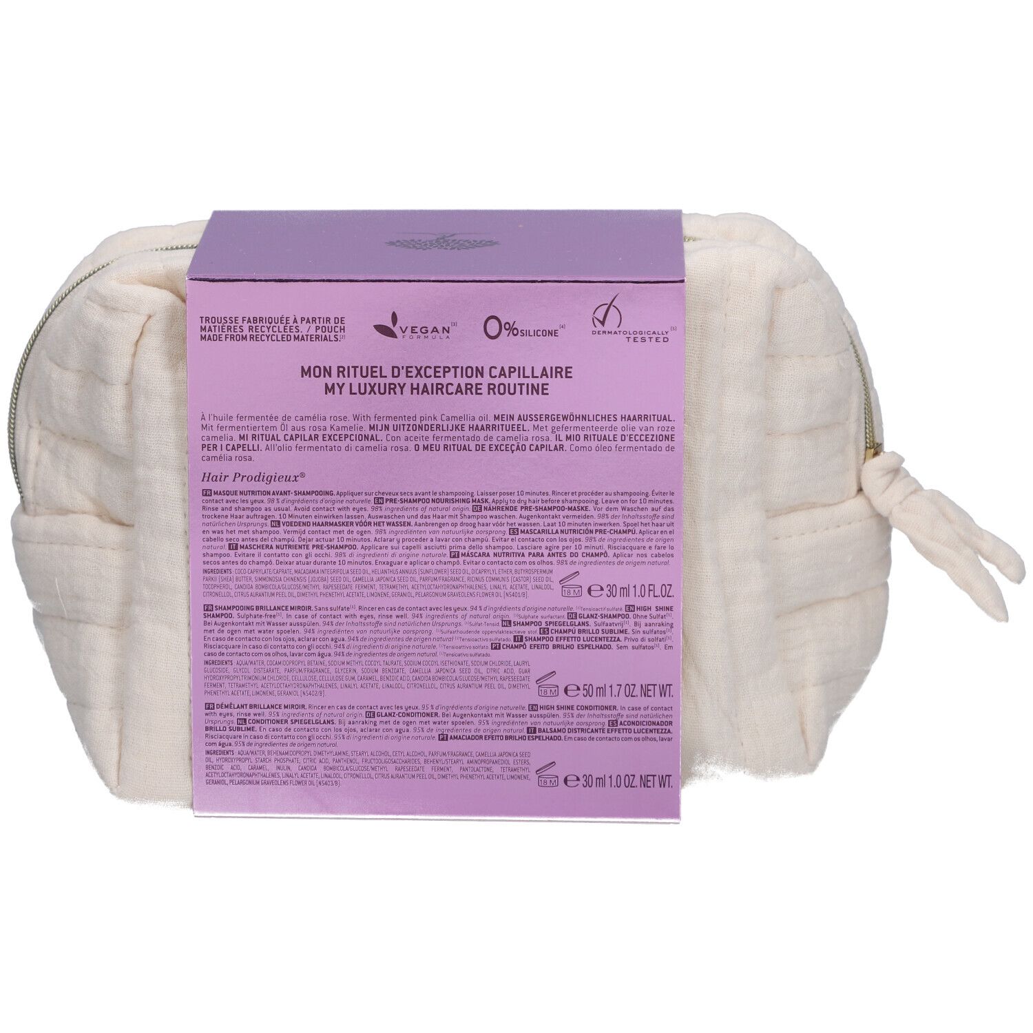 Rückseite der Kosmetiktasche mit NUXE-Haarpflegeprodukten. Enthält Produktinformationen und Logos. Vegan- und Herkunftszeichen.
