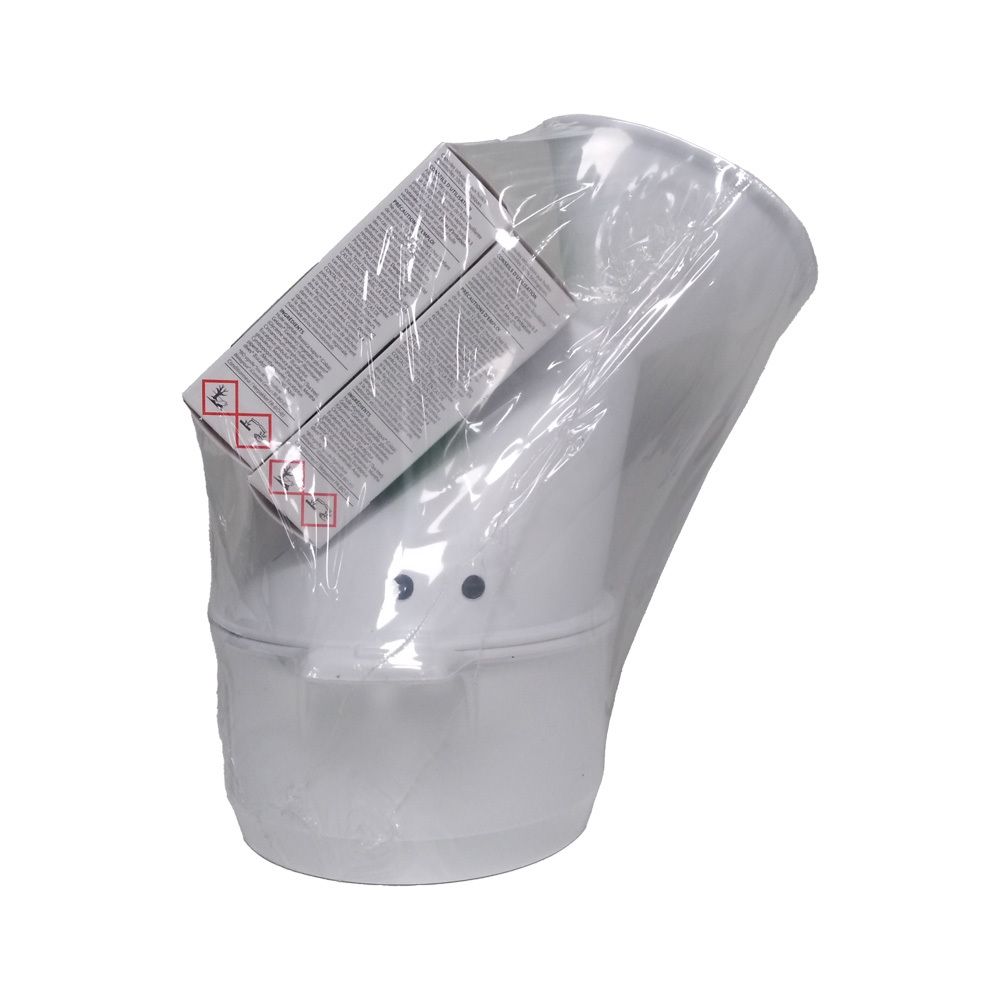 Weißer Inhalator, verpackt in Folie. Auf dem Inhalator: Schachtel mit Warnsymbolen. 