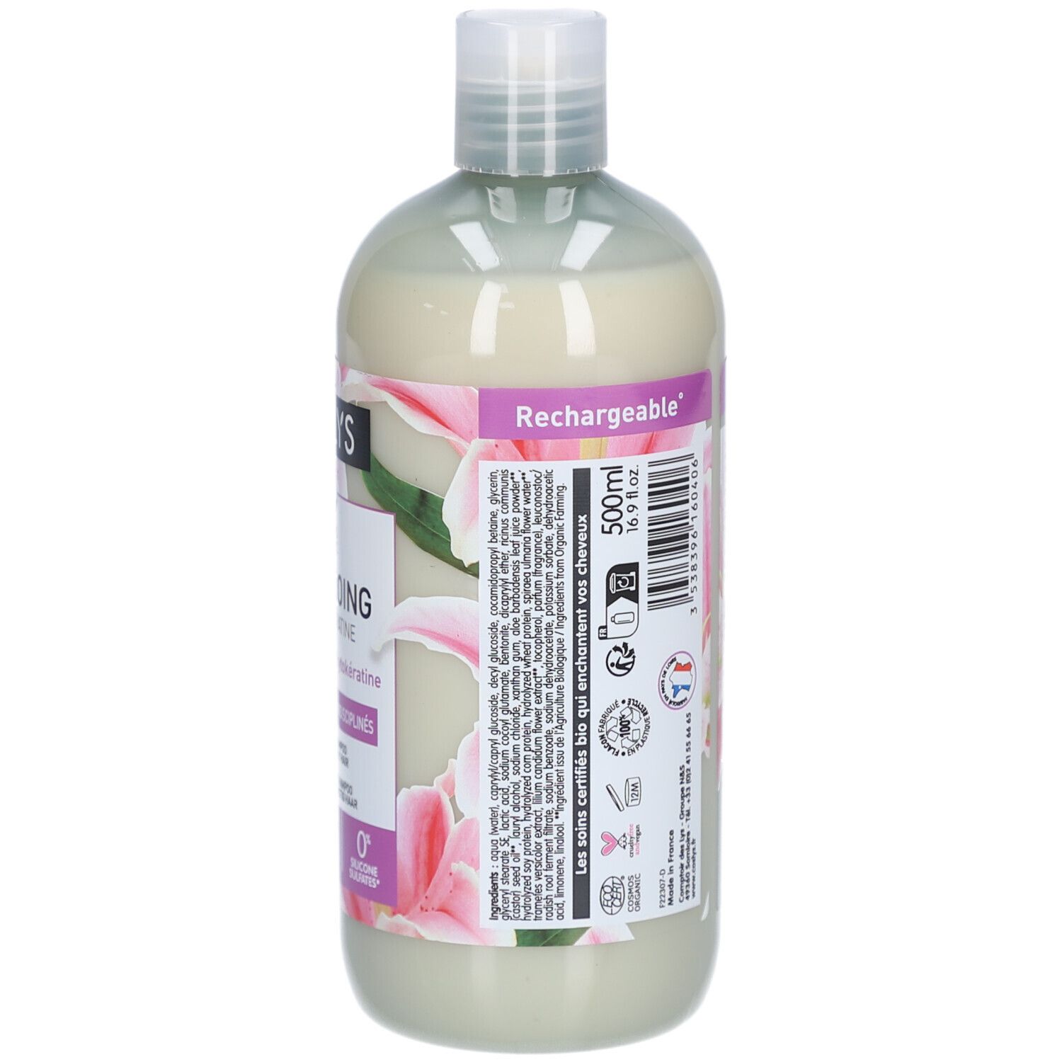 Rückseite der Shampoo-Flasche. Text: 500ml. Inhaltsstoffe und Anwendungshinweise. Mit Bio-Siegel und Blumenmuster.