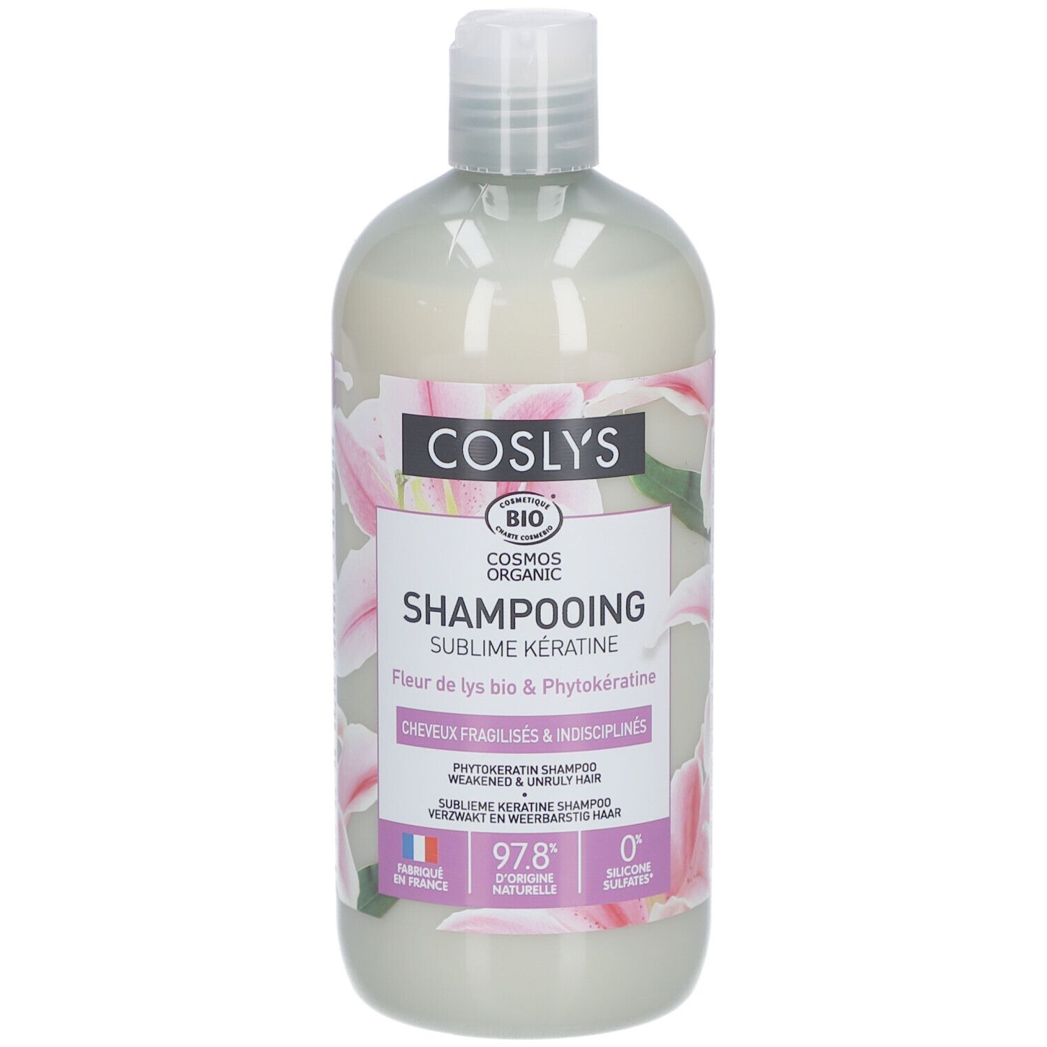 Shampoo-Flasche mit weißem Inhalt. Aufschrift: Coslys, Shampooing Sublime Kératine. Mit Bio-Siegel und Blumenmuster.