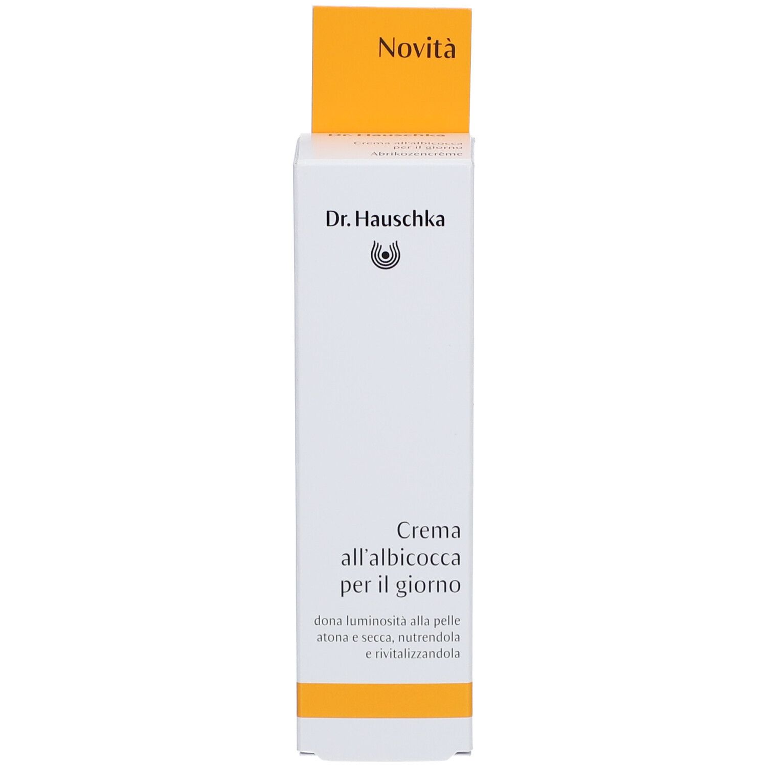 Weiße Schachtel mit gelbem Deckel. Aufdruck: Dr. Hauschka, Creme all'albicocca per il giorno, 'Novità'.
