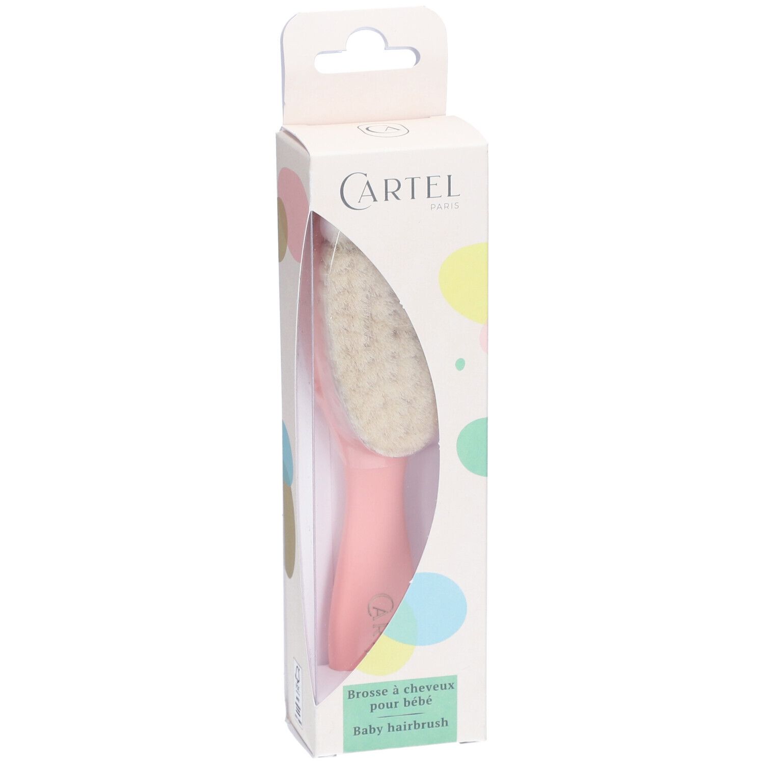 Brosse à cheveux pour bébé dans son emballage. Brosse avec tête en poils clairs et manche rose. Boîte avec logo.