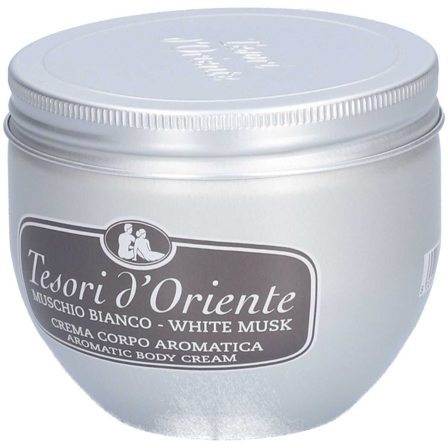 Pot argenté avec couvercle. Étiquette avec texte: Tesori d'Oriente, Muschio Bianco - White Musk, Crème Corps Aromatique.