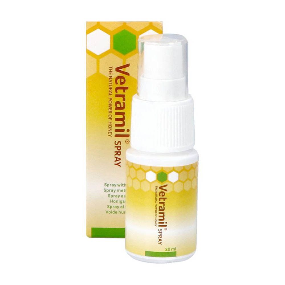 Flacon spray blanc et boîte. Inscription : Vetramil Spray, 20 ml. Design jaune avec motif en nid d'abeilles.