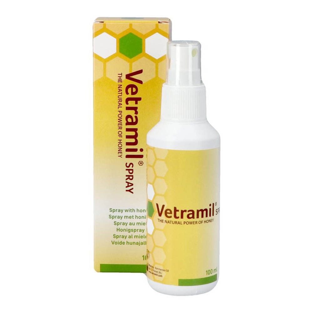 Flacon spray et boîte. Inscription : Vetramil Spray, miel. Emballage jaune et blanc avec motif en nid d'abeille.