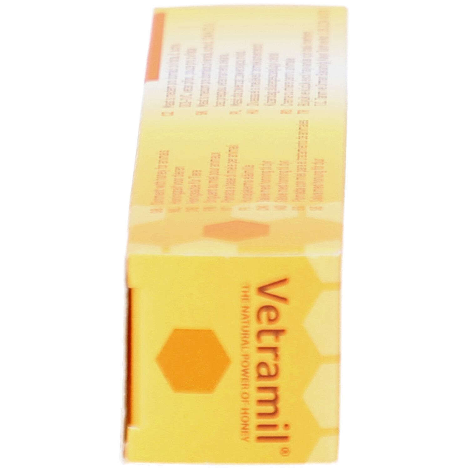 Seite der Vetramil Creme-Schachtel. Gelb mit Markennamen und mehrsprachigen Produktinformationen.