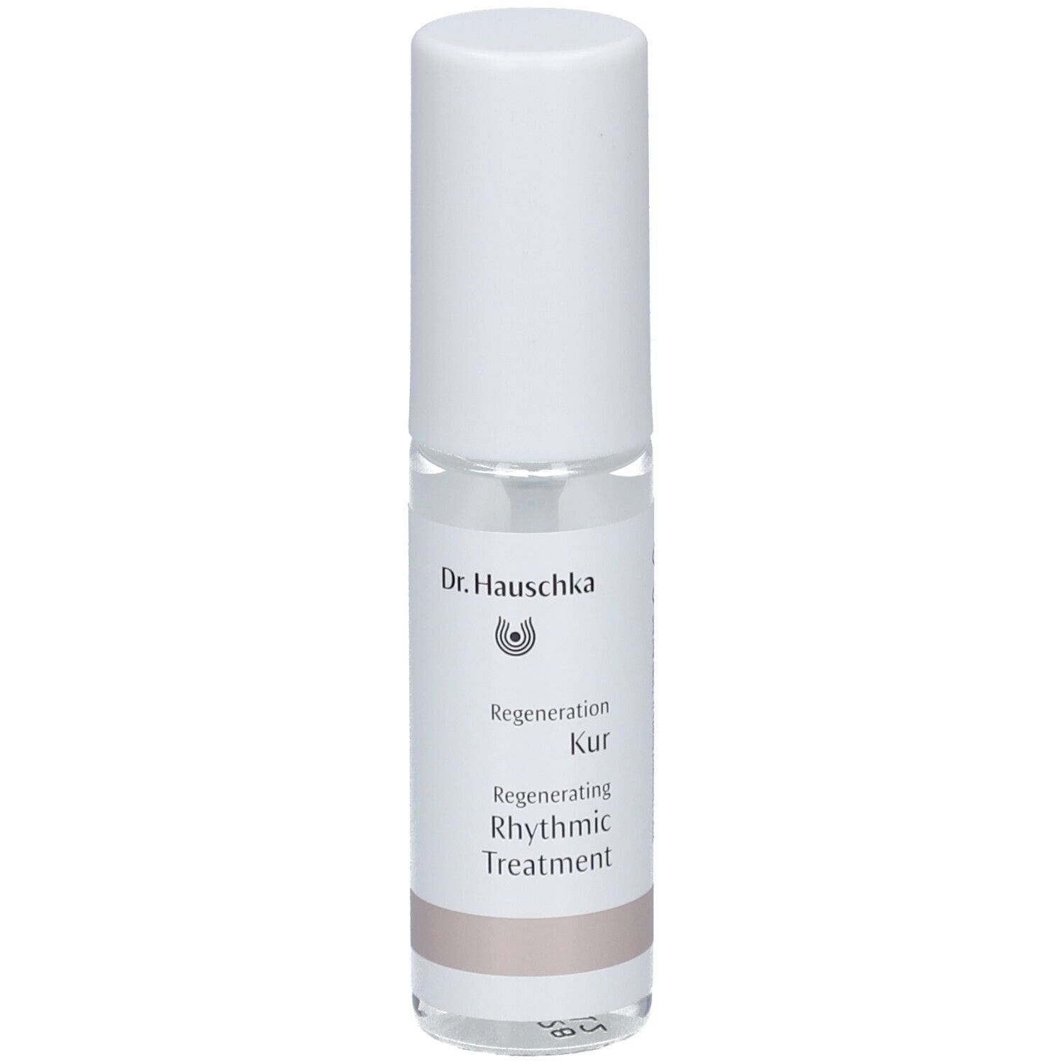 Flacon cylindrique blanc. Étiquette avec nom et logo du produit. Liquide clair visible.