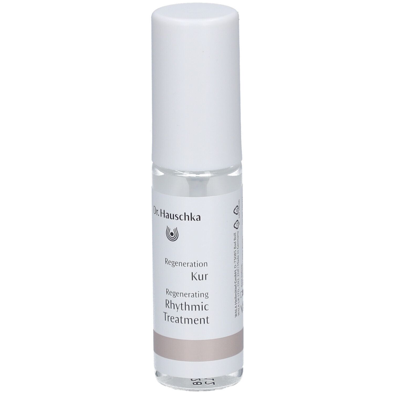 Flacon cylindrique blanc. Étiquette avec nom et logo du produit. Liquide clair visible.