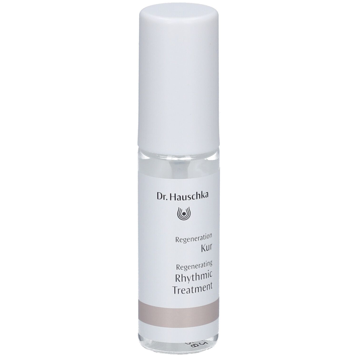 Flacon cylindrique blanc. Étiquette avec nom et logo du produit. Liquide clair visible.