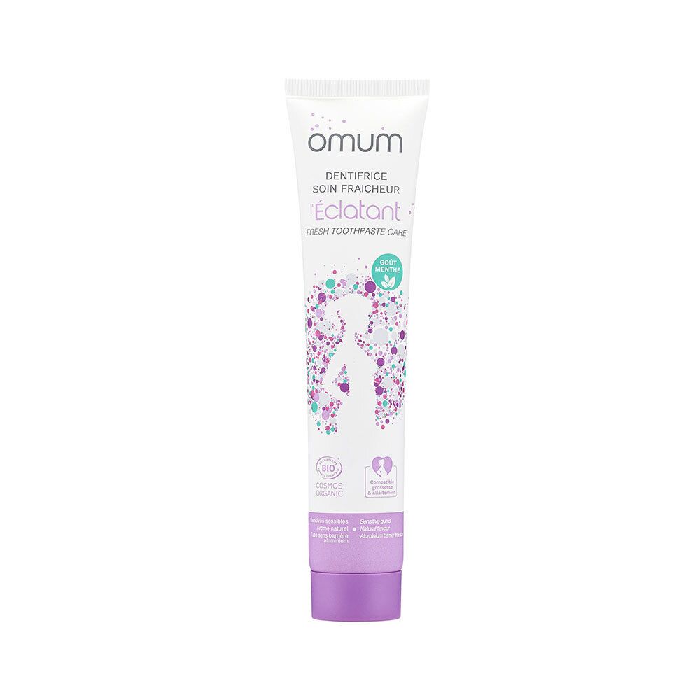 Tube blanc, bouchon violet. Inscription Omum, Dentifrice Soin Fraîcheur, L'Éclatant. Certification bio.