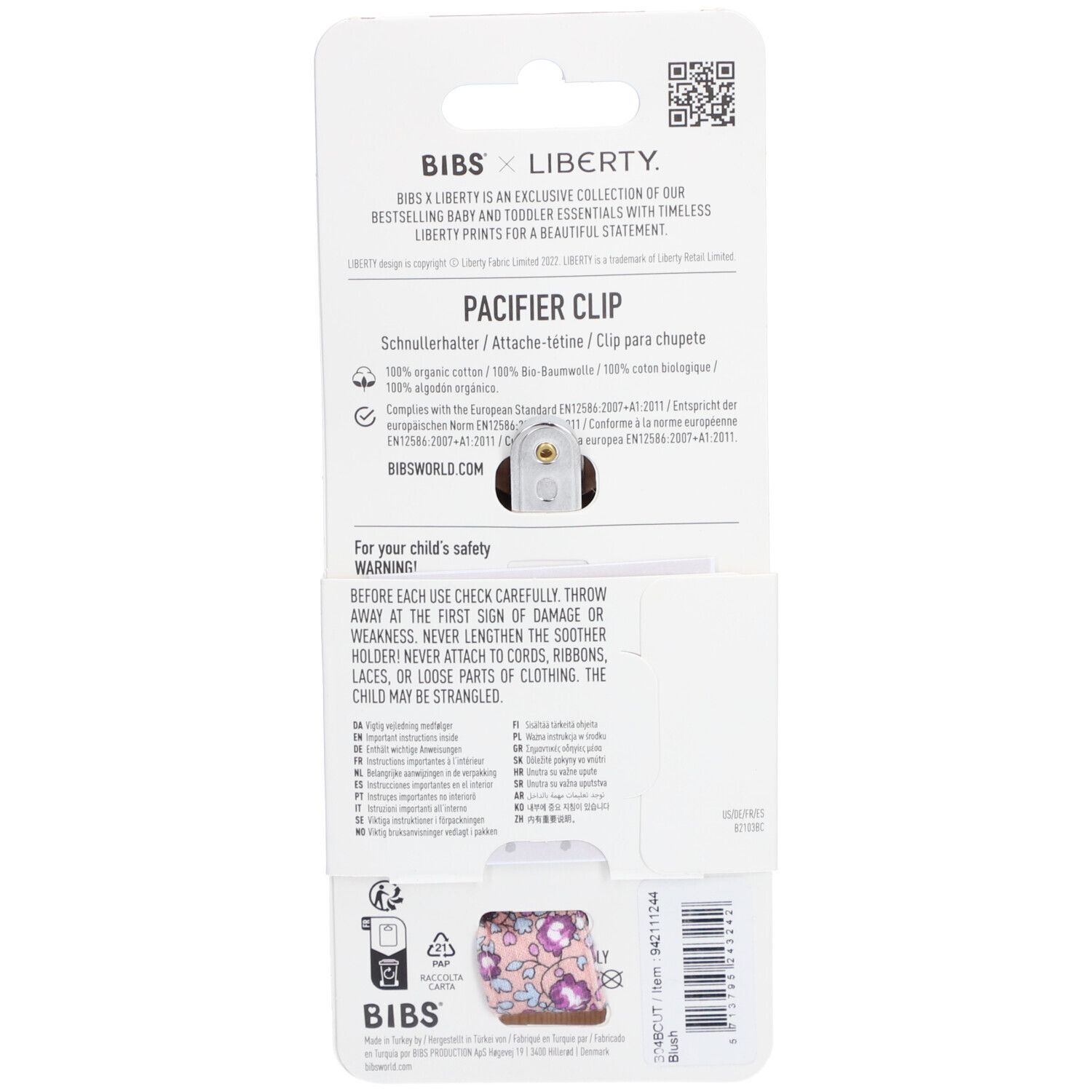 Dos de l'emballage de l'attache-tétine. Texte : BIBS x Liberty. Nom du produit : PACIFIER CLIP. Informations et avertissements.
