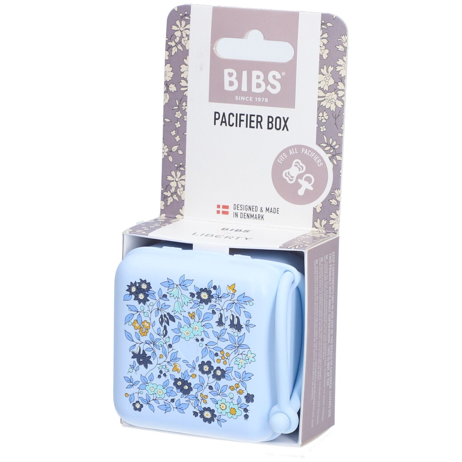 BIBS Schnullerbox Liberty Blue. Hellblaue Box mit Blumenmuster. Verpackung mit BIBS-Logo und Produktbezeichnung.