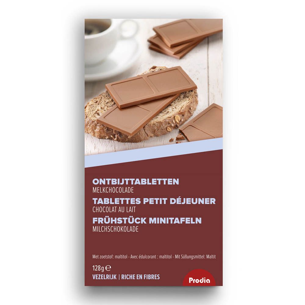 Boîte de tablettes de petit déjeuner au chocolat au lait. Texte: Tablettes Petit Déjeuner Chocolat au Lait. Marque: Prodia. 128g. Sur du pain.