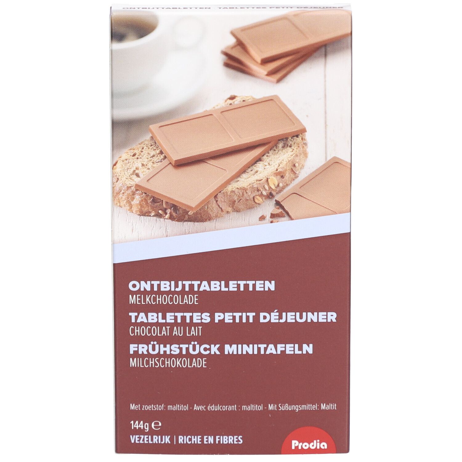 Verpackung mit Schokoladen-Frühstückstafeln. Text: Tablettes Petit Déjeuner Chocolat au Lait. Marke: Prodia. 144g. Reich an Ballaststoffen.