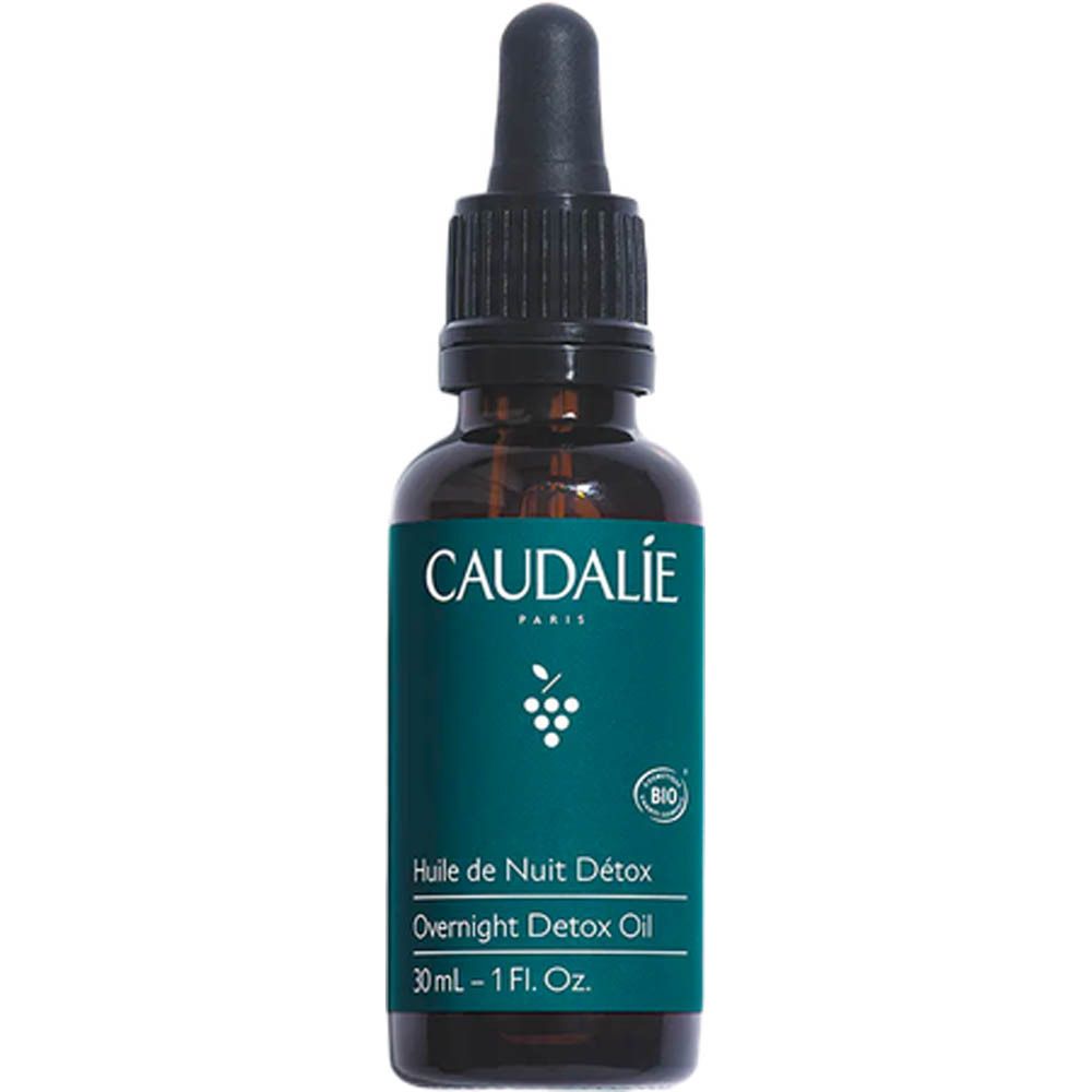 Flacon en verre brun avec pipette. Inscription: Caudalie, Huile de Nuit Détox, Overnight Detox Oil. 30ml - 1 Fl.Oz. Bio.