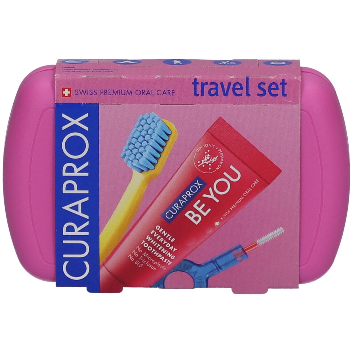 Rosa Reise-Set mit Zahnbürste, Zahnpasta und Interdentalbürste. Marke Curaprox. Verpackung mit Produktabbildung.