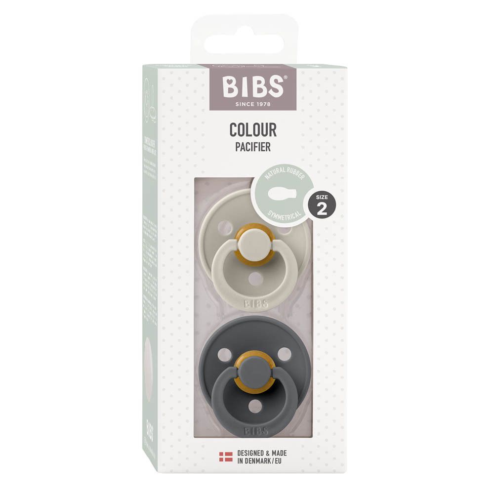 Boîte de deux sucettes. Logo BIBS et nom du produit. Tétine symétrique. Taille 2 (6-18 mois).