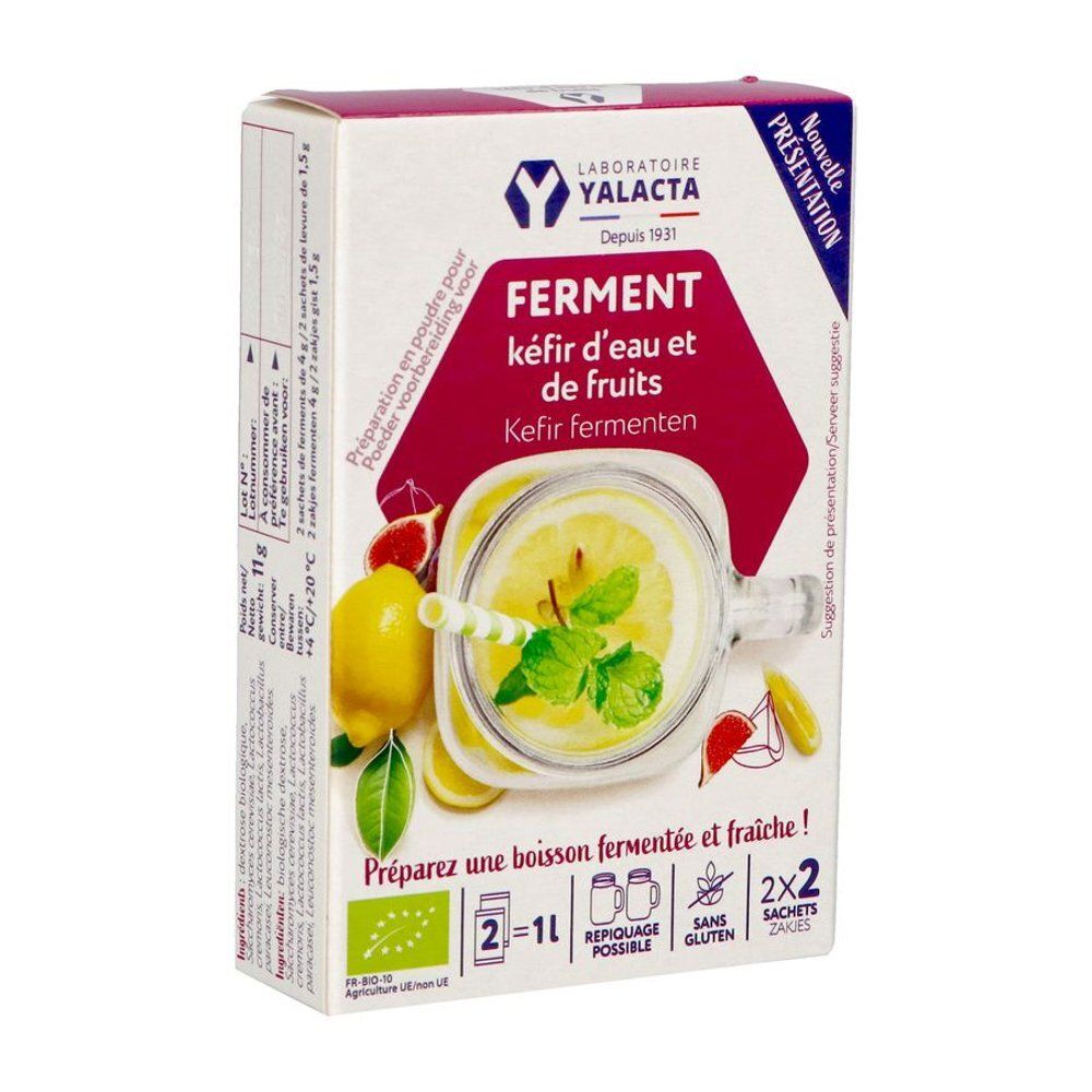 Boîte en carton avec illustration du produit. Inscription: FERMENT kéfir d'eau et de fruits. Illustration d'une boisson avec citron et menthe.