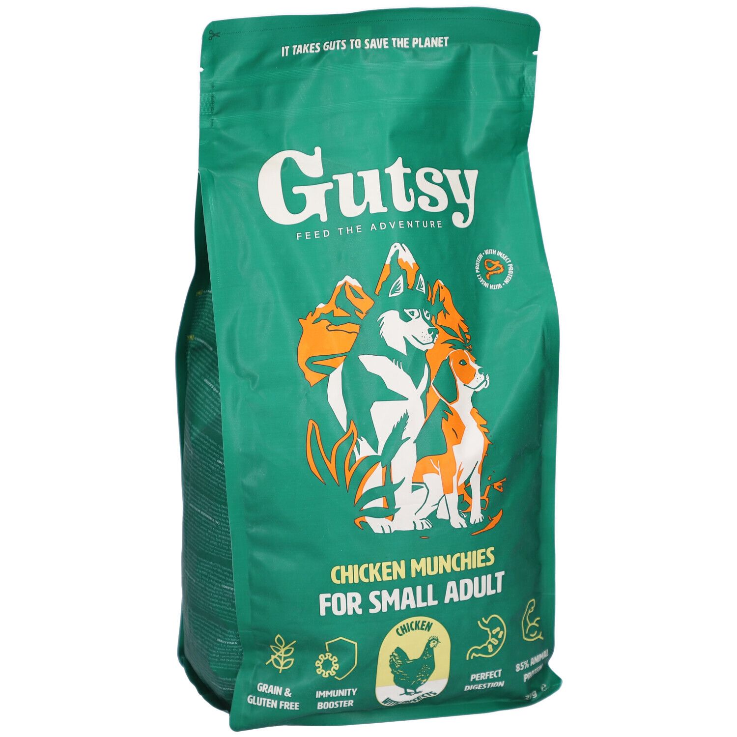 Grüne Tüte mit Aufdruck. Gutsy Chicken Munchies für kleine Hunde. Abbildung von Hunden und Bergen. Text: Grain & Gluten Free.