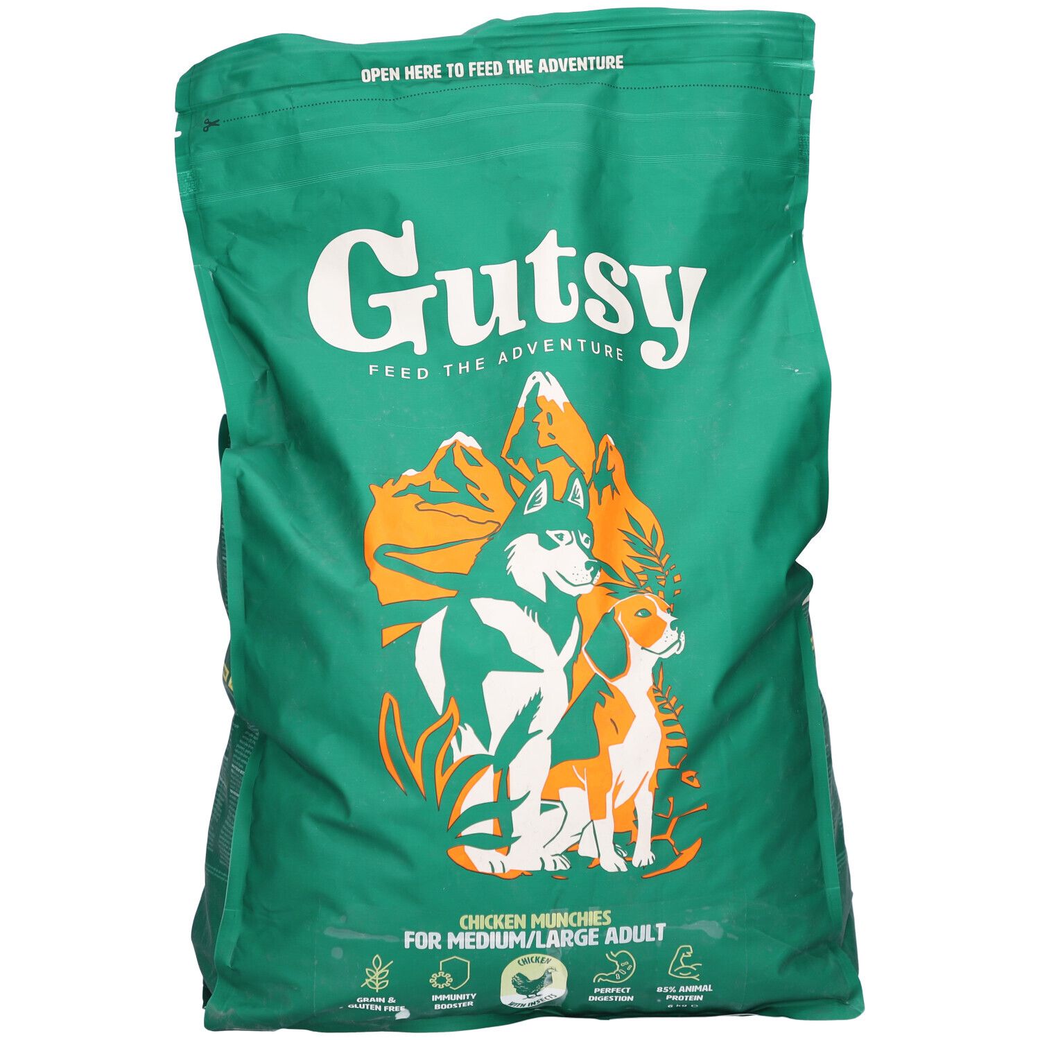 Sac vert Gutsy avec logo et chiens. Texte: Chicken Munchies pour chiens moyens/grands. Fermeture éclair en haut.