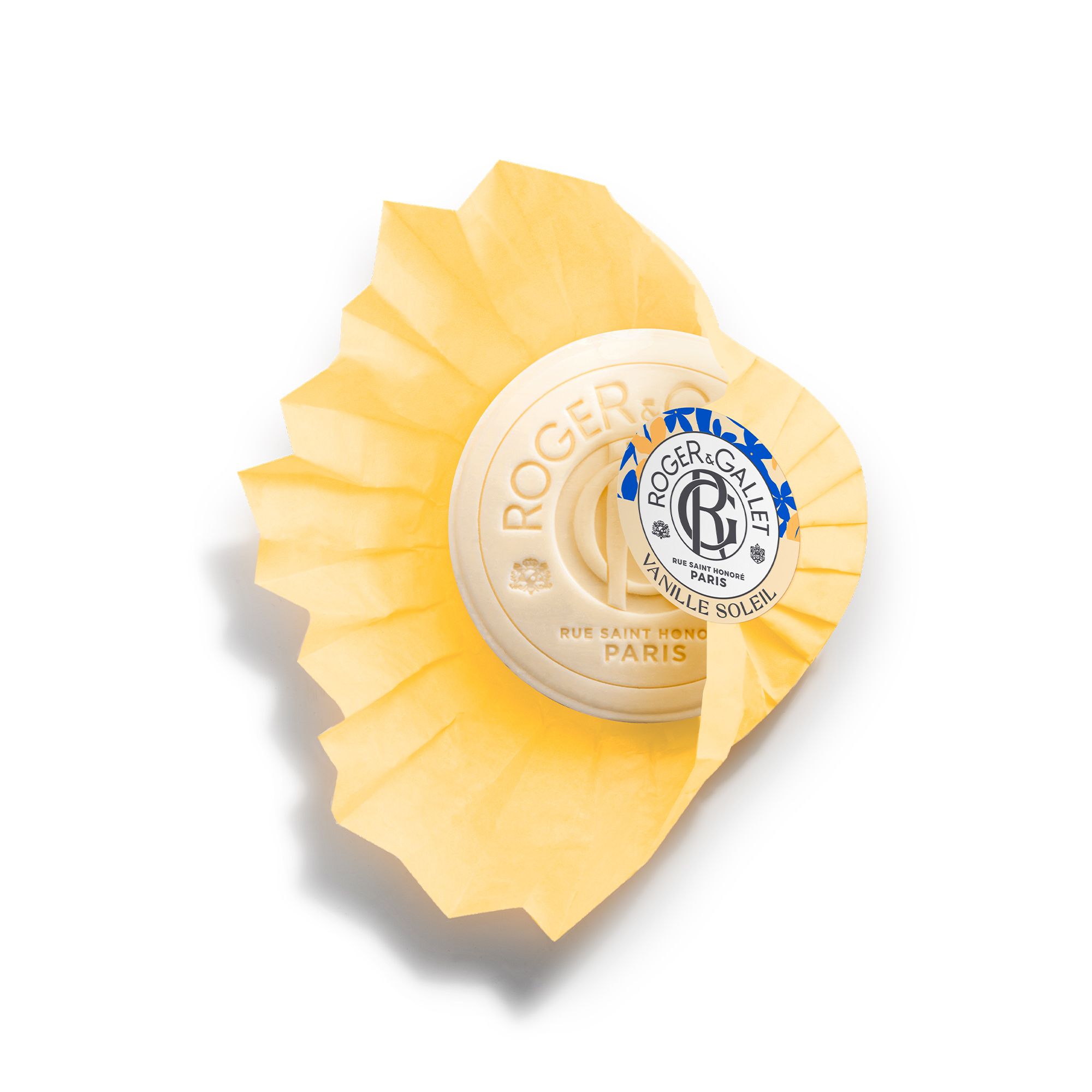 Savon dans emballage papier jaune. Inscription: Roger & Gallet. Fond blanc.