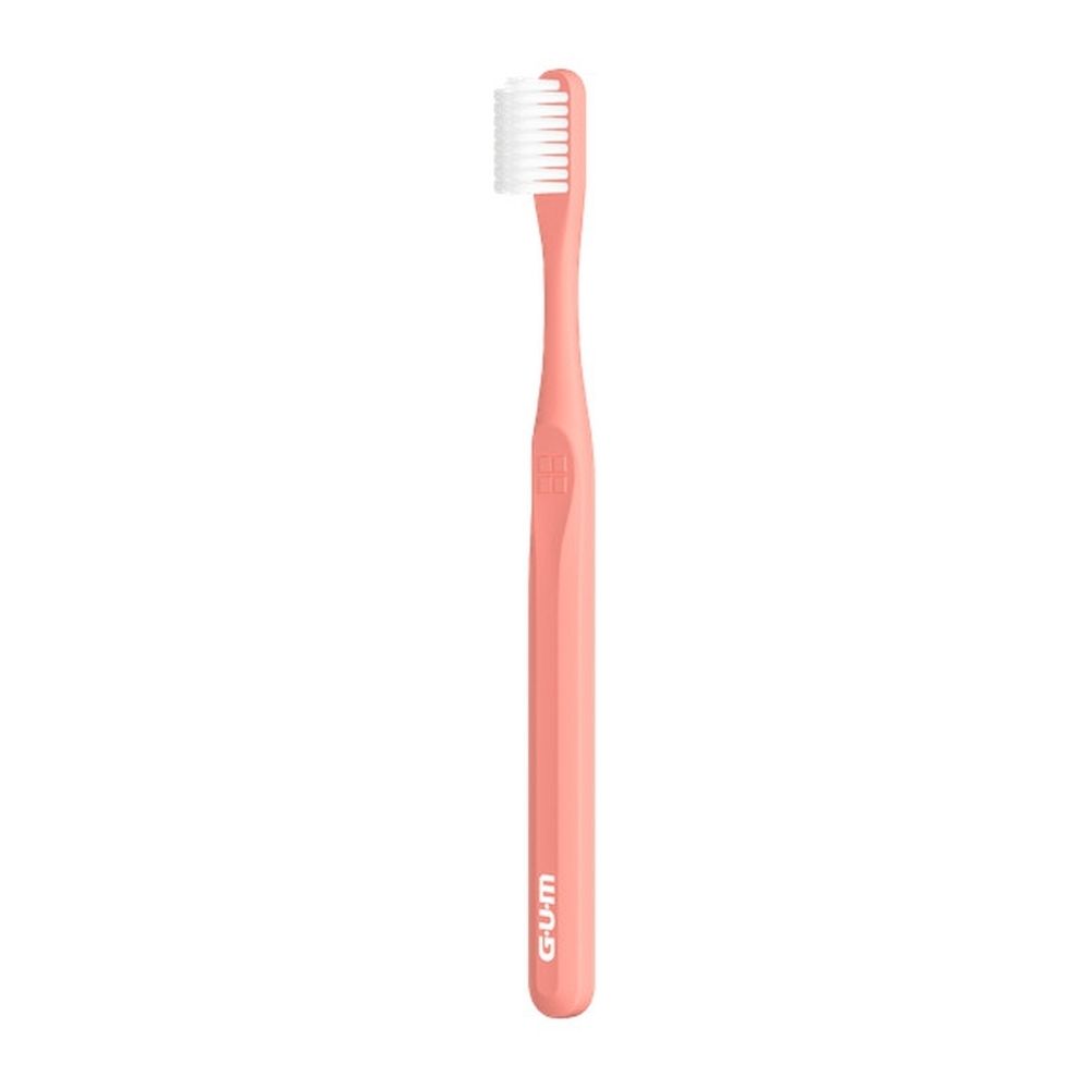 Brosse à dents rose avec tête de brosse blanche. Logo GUM sur le manche. GUM Classic Compact Weiche Zahnbürste 409.